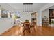Bright dining room with hardwood floors and a charming round table at 420 Nelson St, Durham, NC 27707
