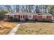 Brick Ranch house with a landscaped yard at 420 Nelson St, Durham, NC 27707