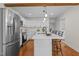 Updated kitchen with stainless steel appliances and white cabinetry at 420 Nelson St, Durham, NC 27707