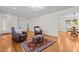 Spacious living room features hardwood floors, comfortable seating, and views to the dining area at 420 Nelson St, Durham, NC 27707