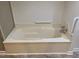 Relaxing bathtub with grab bars for safety and comfort at 446 Crossvine Close, Pittsboro, NC 27312