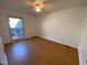 Bright bedroom with hardwood floors and ceiling fan at 446 Crossvine Close, Pittsboro, NC 27312