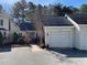 Exterior of charming condo with attached garage and manicured landscaping at 446 Crossvine Close, Pittsboro, NC 27312