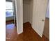 Hallway with hardwood floors and a coat closet at 446 Crossvine Close, Pittsboro, NC 27312