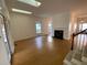 Open living room with hardwood floors and fireplace at 446 Crossvine Close, Pittsboro, NC 27312
