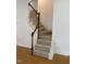 Elegant staircase with carpeted steps and wooden railing at 446 Crossvine Close, Pittsboro, NC 27312