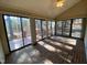 Bright sunroom with brick flooring and large windows leading to outdoor deck space at 446 Crossvine Close, Pittsboro, NC 27312