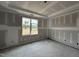 Bright bedroom with a large window offering an outdoor view and fresh drywall at 59 Pretty Run Branch Ln, Wendell, NC 27591
