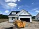 Charming, newly built one-story home featuring white siding, a black roof, and an attached two-car garage at 59 Pretty Run Branch Ln, Wendell, NC 27591