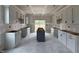 Unfinished kitchen with white cabinets, a center island, and sliding glass doors at 59 Pretty Run Branch Ln, Wendell, NC 27591