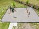 Aerial view of a community playground area featuring slides, swings and green space at 59 Pretty Run Branch Ln, Wendell, NC 27591