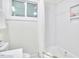 Bathroom with white tile shower and bathtub at 713 Hudson Ave, Durham, NC 27704