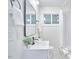 Clean bathroom with white vanity and large mirror at 713 Hudson Ave, Durham, NC 27704