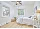 Bright bedroom with light flooring and large windows at 713 Hudson Ave, Durham, NC 27704
