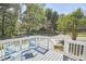 Deck with white railings and blue chairs, street view at 713 Hudson Ave, Durham, NC 27704