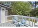 Deck with white railings and blue chairs, overlooking yard at 713 Hudson Ave, Durham, NC 27704