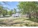 Spacious deck with white railings and blue chairs at 713 Hudson Ave, Durham, NC 27704