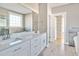 Elegant bathroom with double vanity, soaking tub, and walk-in shower at 7723 Barefoot Rd, Fuquay Varina, NC 27526