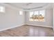 Bright bedroom with hardwood floors and large windows at 7723 Barefoot Rd, Fuquay Varina, NC 27526