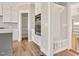 Kitchen features white cabinets, walk-in pantry, and built-in oven at 7723 Barefoot Rd, Fuquay Varina, NC 27526