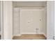 Laundry room with built-in shelving and hookups at 7723 Barefoot Rd, Fuquay Varina, NC 27526