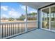 Spacious screened porch with sliding glass doors and backyard view at 7723 Barefoot Rd, Fuquay Varina, NC 27526