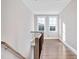 Bright upper hall with hardwood floors and two windows at 7723 Barefoot Rd, Fuquay Varina, NC 27526