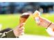 Two children sharing ice cream cones in a park at 802 Tyrrell Rd, Raleigh, NC 27609