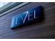 Level restaurant signage on a wood-paneled building at 802 Tyrrell Rd, Raleigh, NC 27609