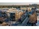 Aerial perspective of a shopping center, showcasing a mix of retail spaces and parking at 806 Tyrrell Rd, Raleigh, NC 27609