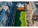 Aerial view of a vibrant community with green space, restaurants, and residential buildings at 806 Tyrrell Rd, Raleigh, NC 27609