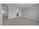 This bedroom has neutral walls, carpet, and a doorway leading to a bathroom at 930 Allen Pk Dr, Raleigh, NC 27604