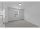 This bedroom features neutral walls, carpet and a window at 930 Allen Pk Dr, Raleigh, NC 27604