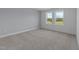 This bedroom features two windows and neutral walls at 930 Allen Pk Dr, Raleigh, NC 27604