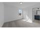 This bedroom features a window and doorway to the bathroom at 930 Allen Pk Dr, Raleigh, NC 27604