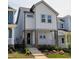 Charming two-story home featuring board and batten siding, brick accents, and a welcoming front porch at 930 Allen Pk Dr, Raleigh, NC 27604