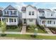 Street view of a modern two-story home featuring neat landscaping, sidewalks, and neighboring houses at 930 Allen Pk Dr, Raleigh, NC 27604