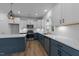 Spacious kitchen featuring white cabinets, stainless steel appliances, white countertops, and a tiled backsplash at 930 Allen Pk Dr, Raleigh, NC 27604
