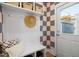 Charming mud room with built-in bench seating, storage shelves, and patterned wallpaper at 930 Allen Pk Dr, Raleigh, NC 27604