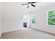 Bright bedroom featuring a ceiling fan and large windows, filling the room with natural light at 0 Cedar Grove Church Rd Rd, Roxboro, NC 27574