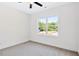 Bright bedroom features a large window with scenic views and neutral carpeting at 0 Cedar Grove Church Rd Rd, Roxboro, NC 27574