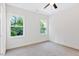 Cozy bedroom featuring plush carpeting and a large window with views of lush greenery at 0 Cedar Grove Church Rd Rd, Roxboro, NC 27574