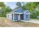 Side view of blue home with white trim and a pink front door, showcasing its curb appeal at 0 Cedar Grove Church Rd Rd, Roxboro, NC 27574