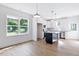 Bright open-concept kitchen featuring white cabinets and a center island at 0 Cedar Grove Church Rd Rd, Roxboro, NC 27574