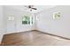 Living room with laminate floors, white walls and trim, and a door to the outside at 0 Cedar Grove Church Rd Rd, Roxboro, NC 27574