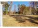 Large backyard with a grassy area and tree line at 0 Theresia Ln, Roxboro, NC 27574