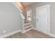 Bright entryway with hardwood floors, stairs, and white door at 0 Theresia Ln, Roxboro, NC 27574