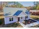 Newly constructed light gray house with a dark blue front door and wood-toned columns at 0 Theresia Ln, Roxboro, NC 27574