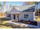 Newly constructed light gray house with a dark blue front door and wood-toned columns at 0 Theresia Ln, Roxboro, NC 27574