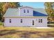Gray house exterior with a back patio and landscaping at 0 Theresia Ln, Roxboro, NC 27574